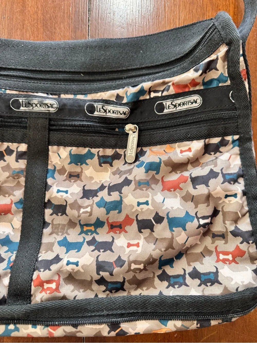 LeSportsac Multi-Dog Print Crossbody in Beige, Blue, Black & Red Accents